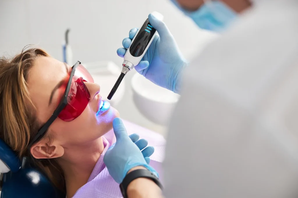 Stomatologist Setting Dental Sealants